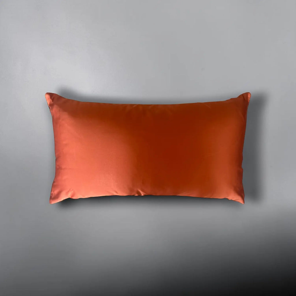Orange cushion on a gray background