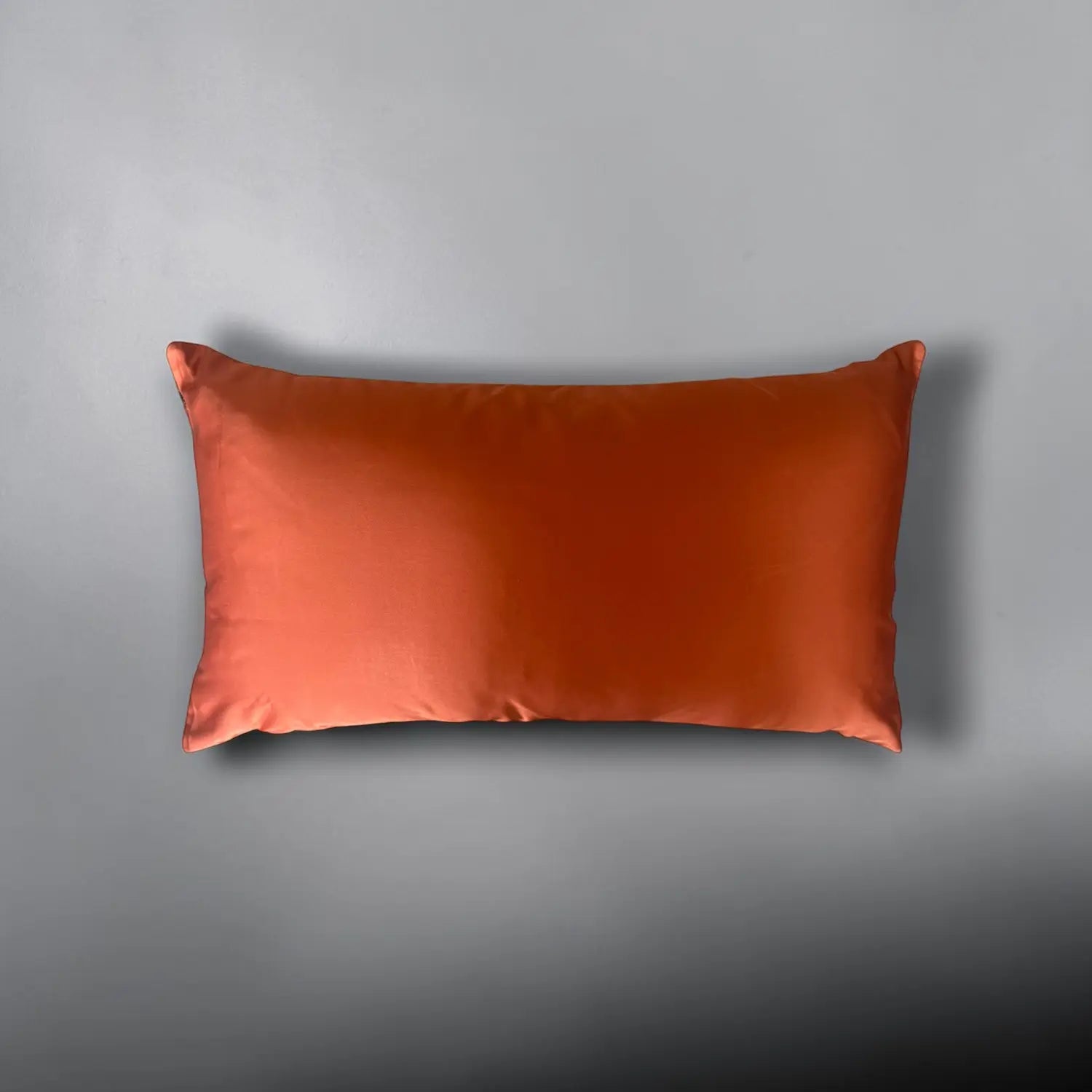 Orange cushion on a gray background
