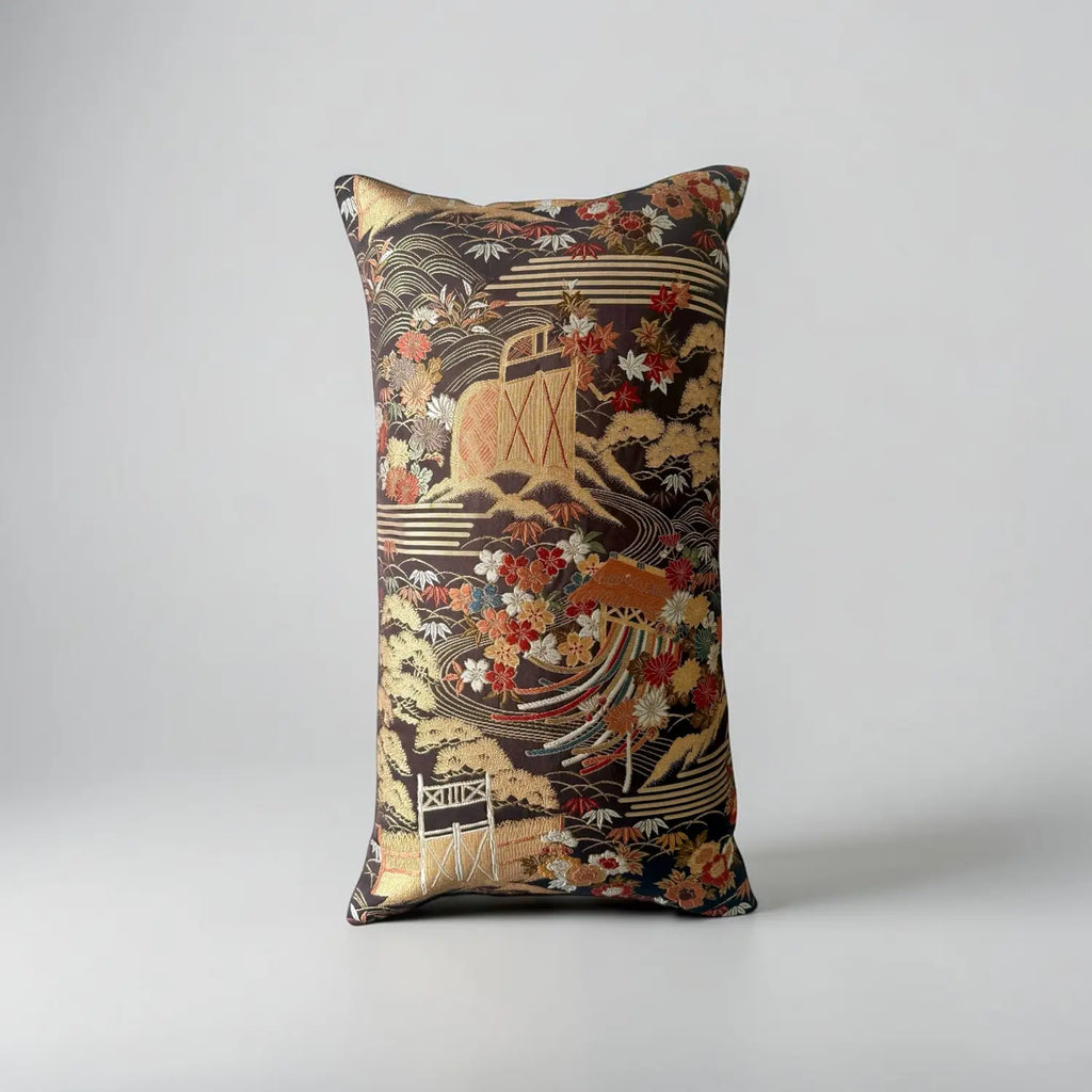 Decorative cushion with intricate patterns on a gray background