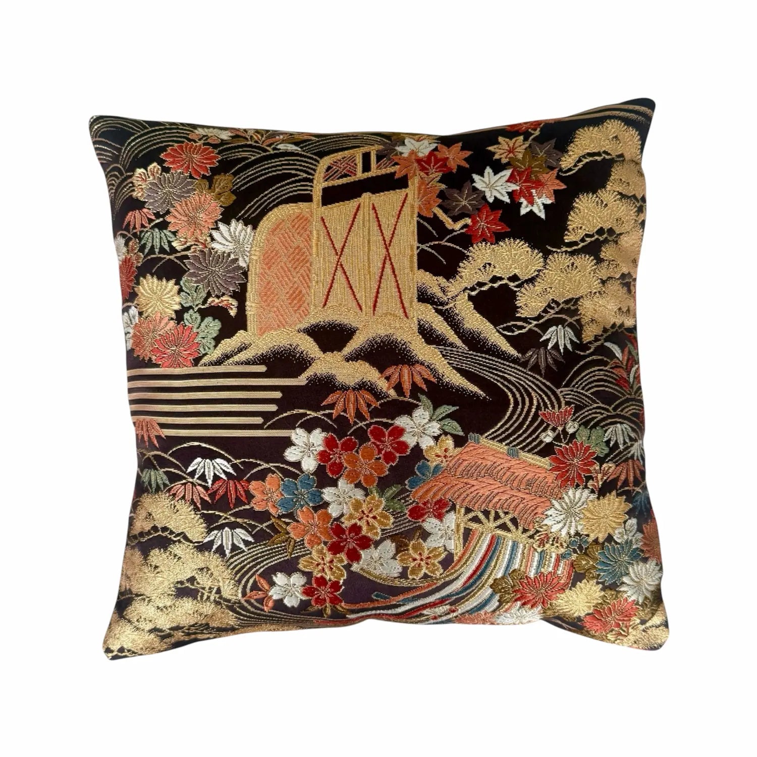 Decorative cushion with intricate floral design on a black background