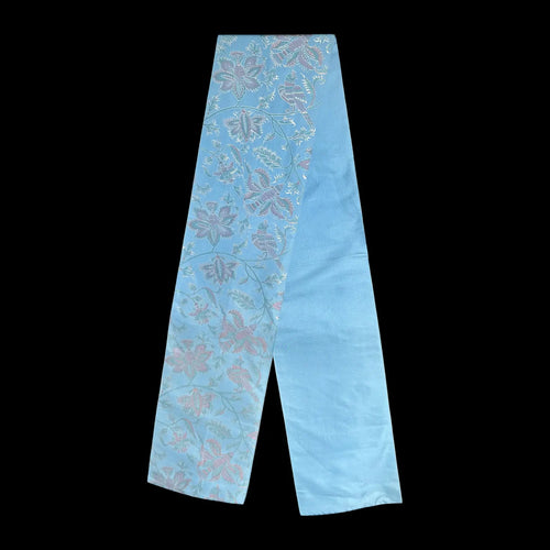 Light blue fabric with floral pattern on a black background