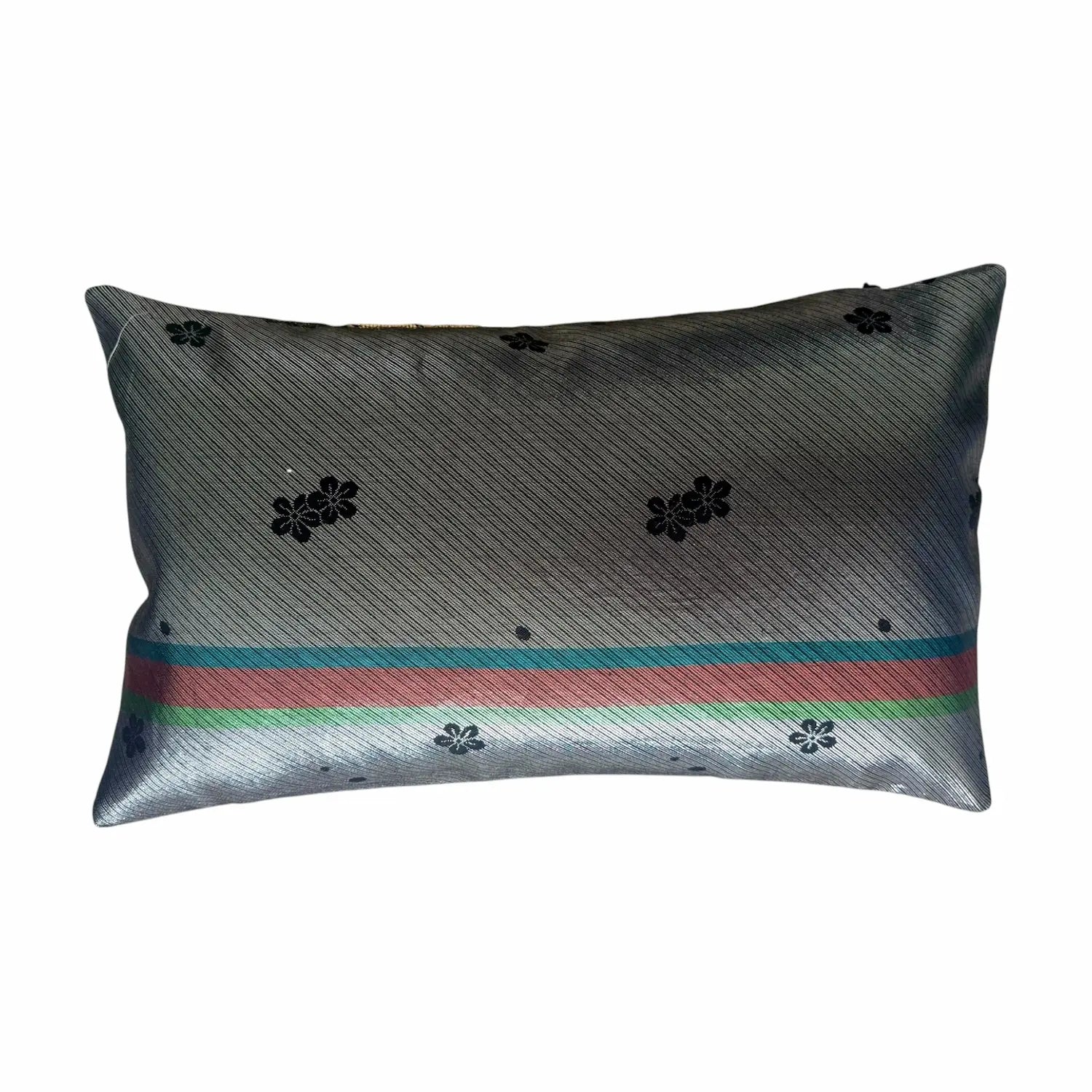 Rectangular gray cushion with floral patterns and colorful stripes on a white background