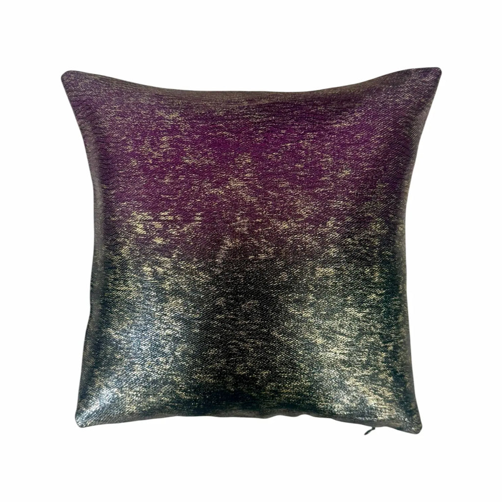 Decorative cushion with purple and gold gradient on a white background