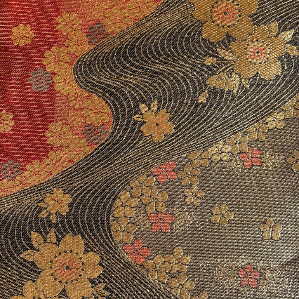 Decorative fabric with floral patterns and wavy lines on a multicolor background