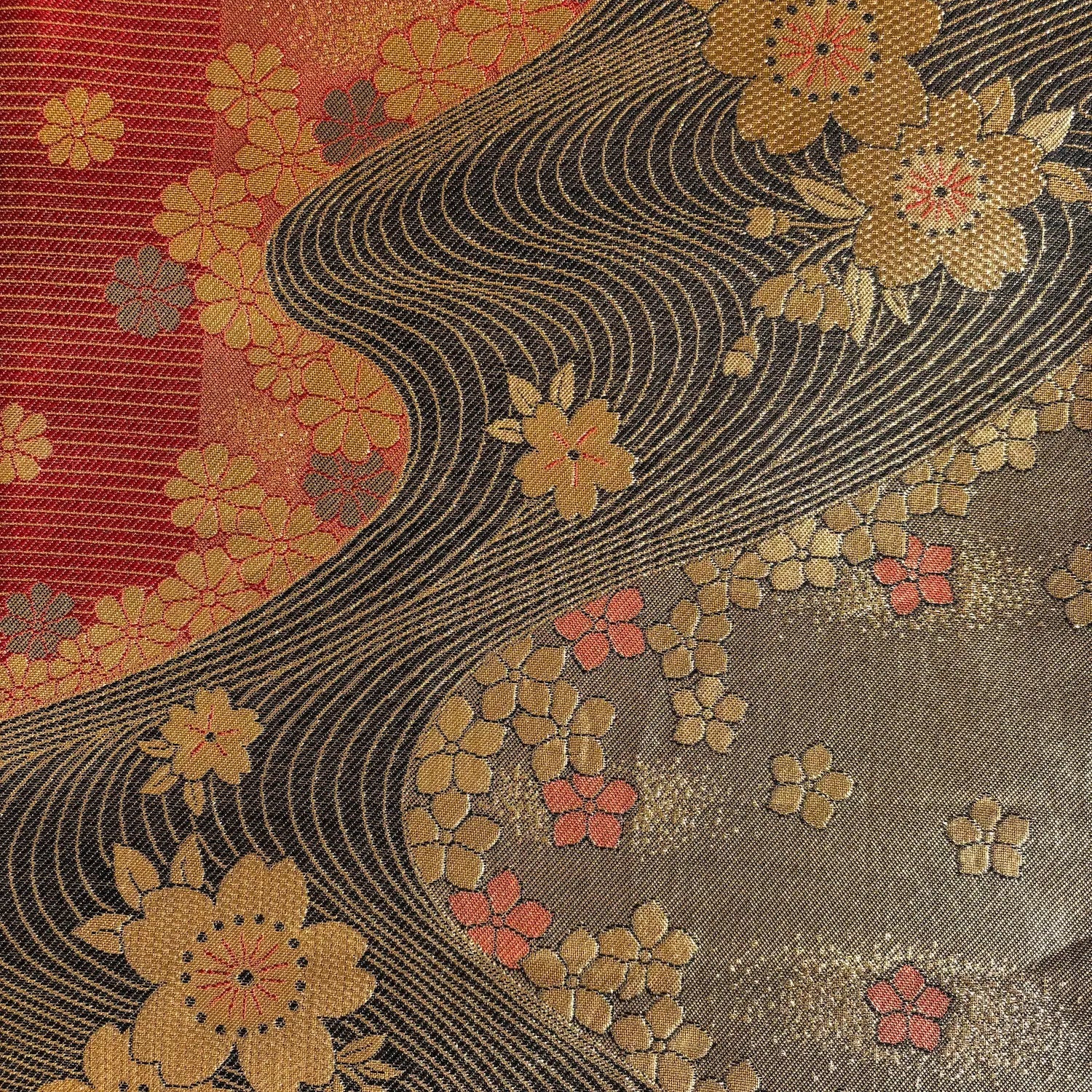 Decorative fabric with floral patterns and wavy lines on a multicolor background