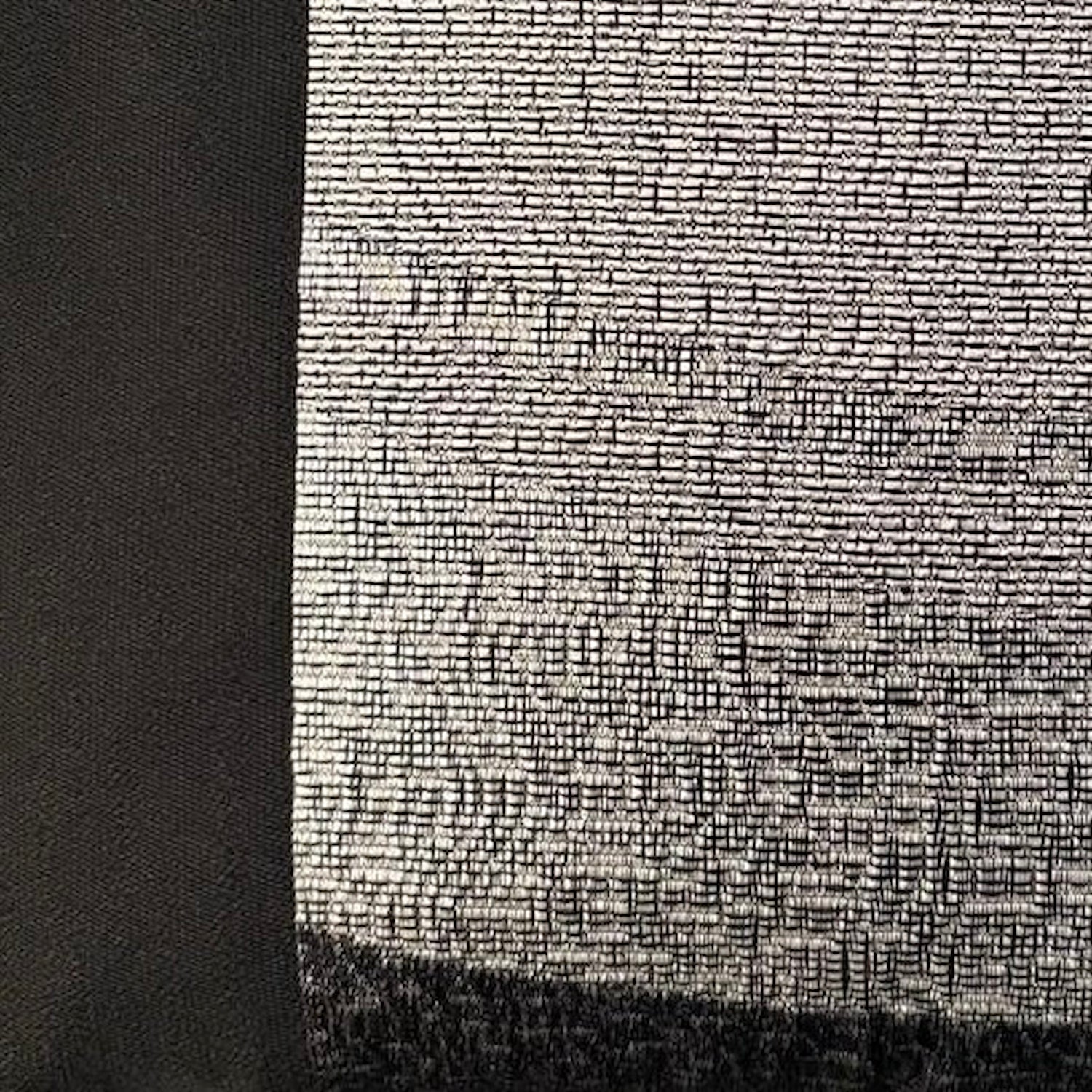 Close-up of a textured black and white fabric pattern