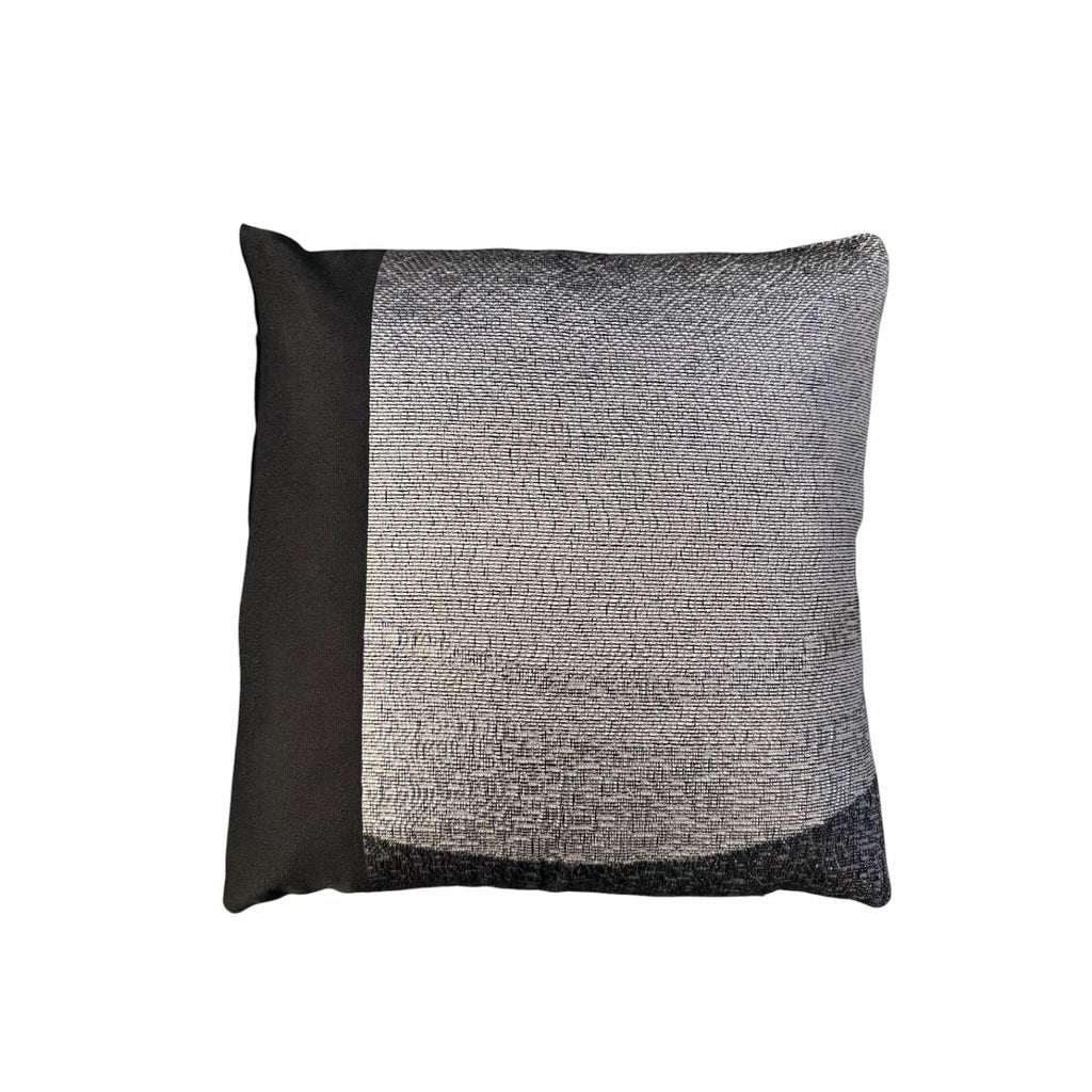 Black and grey textured cushion on a white background