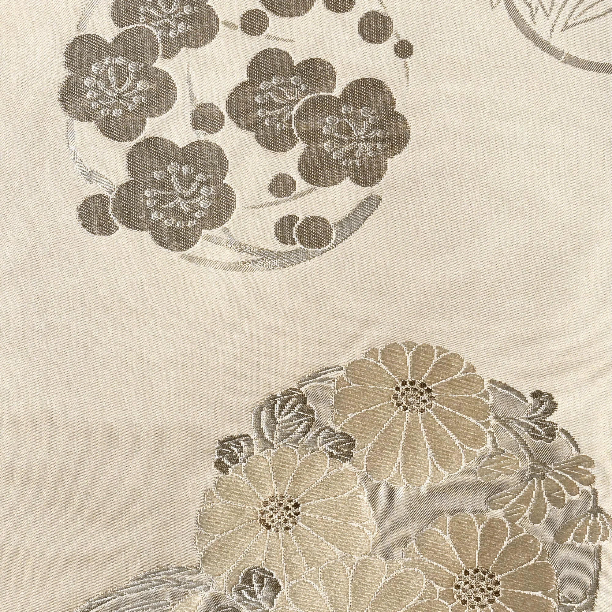 Floral embroidery pattern on a pink fabric background