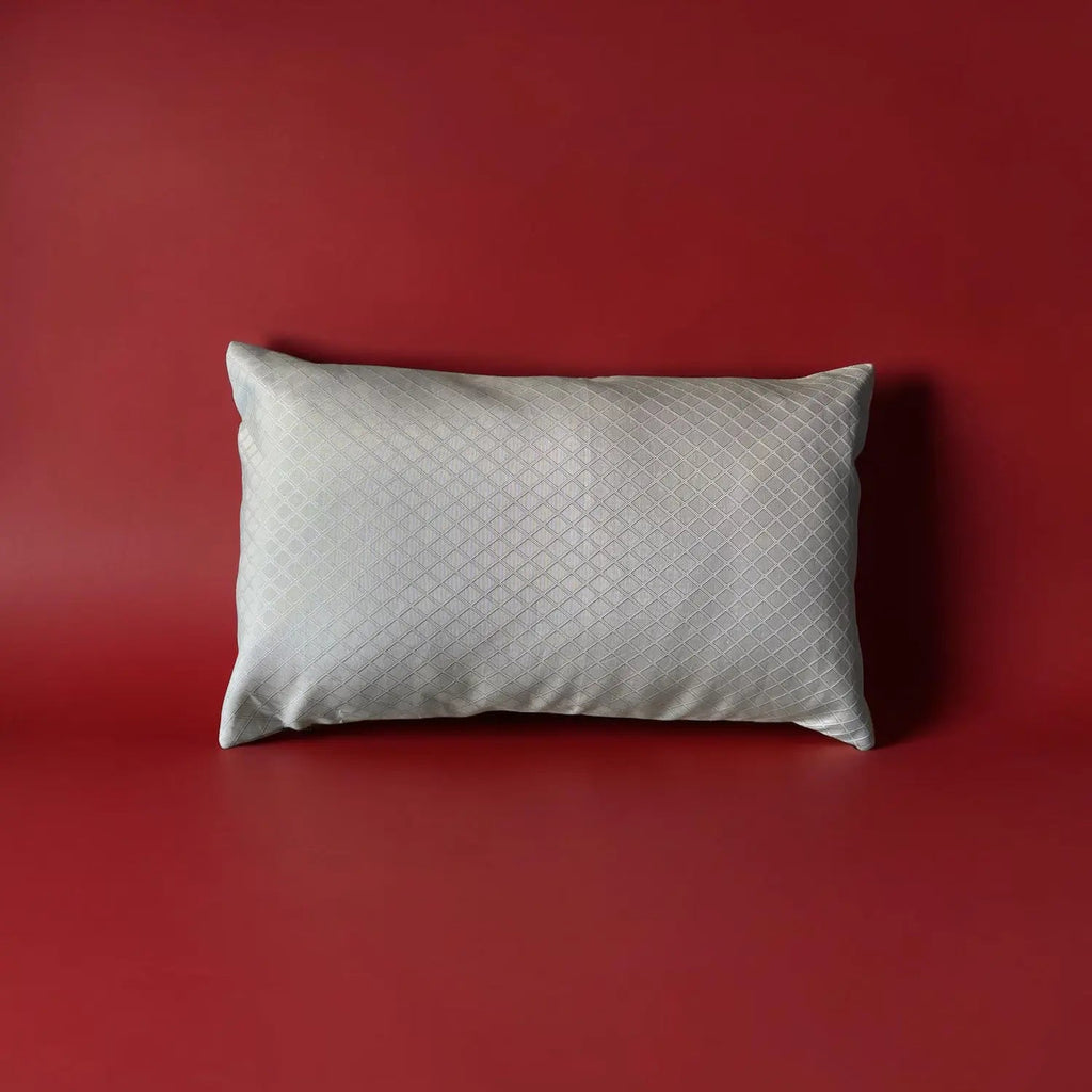 Cream textured pillow on a red background