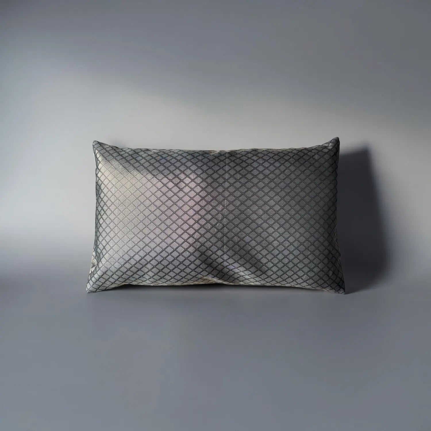 Textured pillow on a gray background