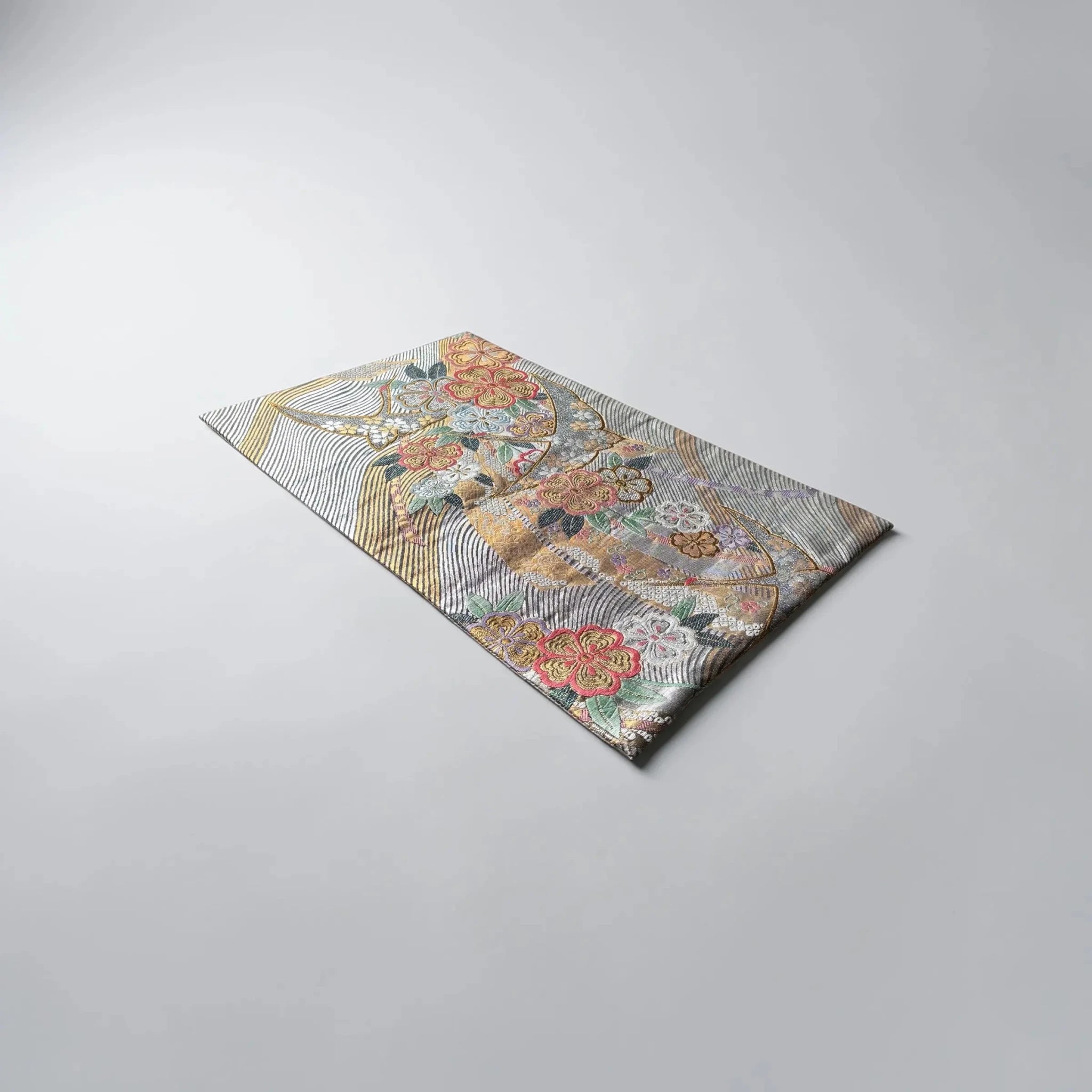 Decorative table runner with floral pattern on a gray background