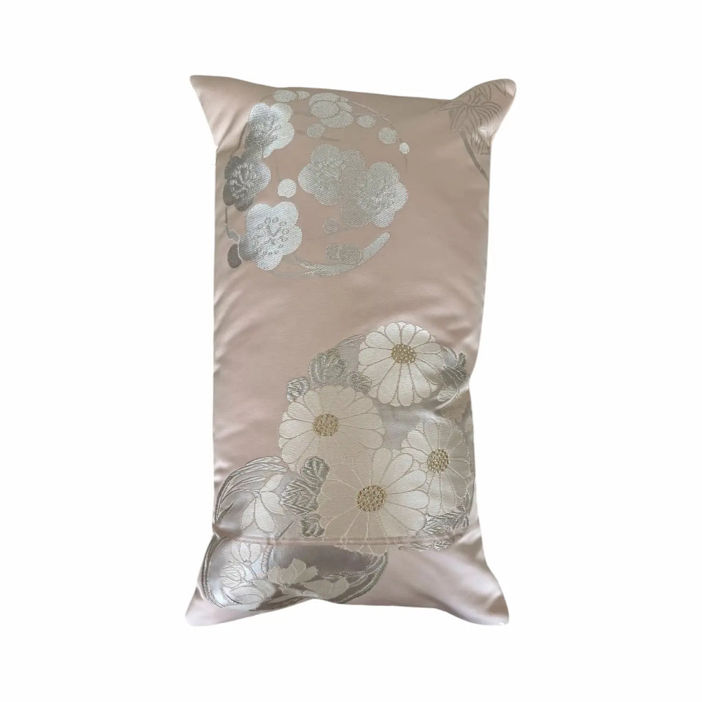 Decorative cushion with floral pattern on a beige background