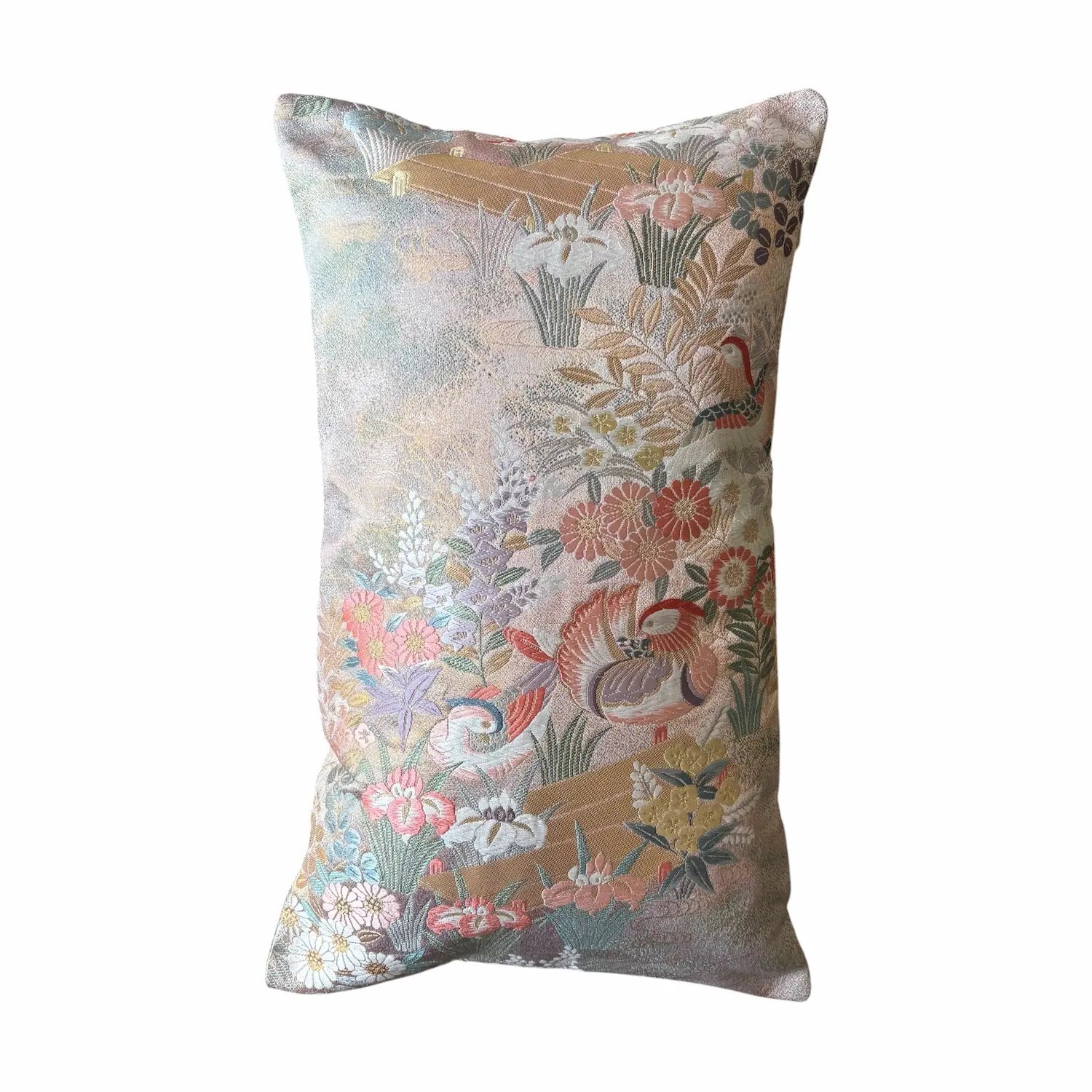 Decorative cushion with floral and bird pattern on a white background