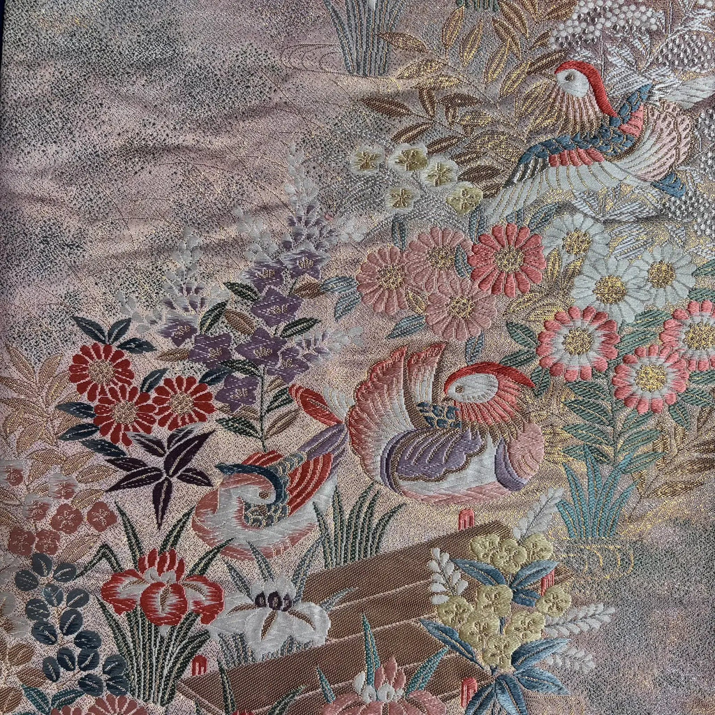 Embroidered fabric with floral and bird patterns