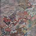 Embroidered fabric with floral and bird patterns