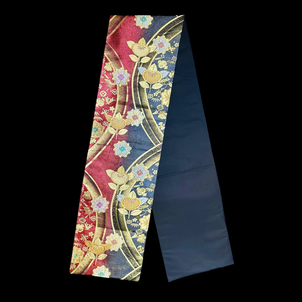 Decorative fabric strip with floral patterns on a black background