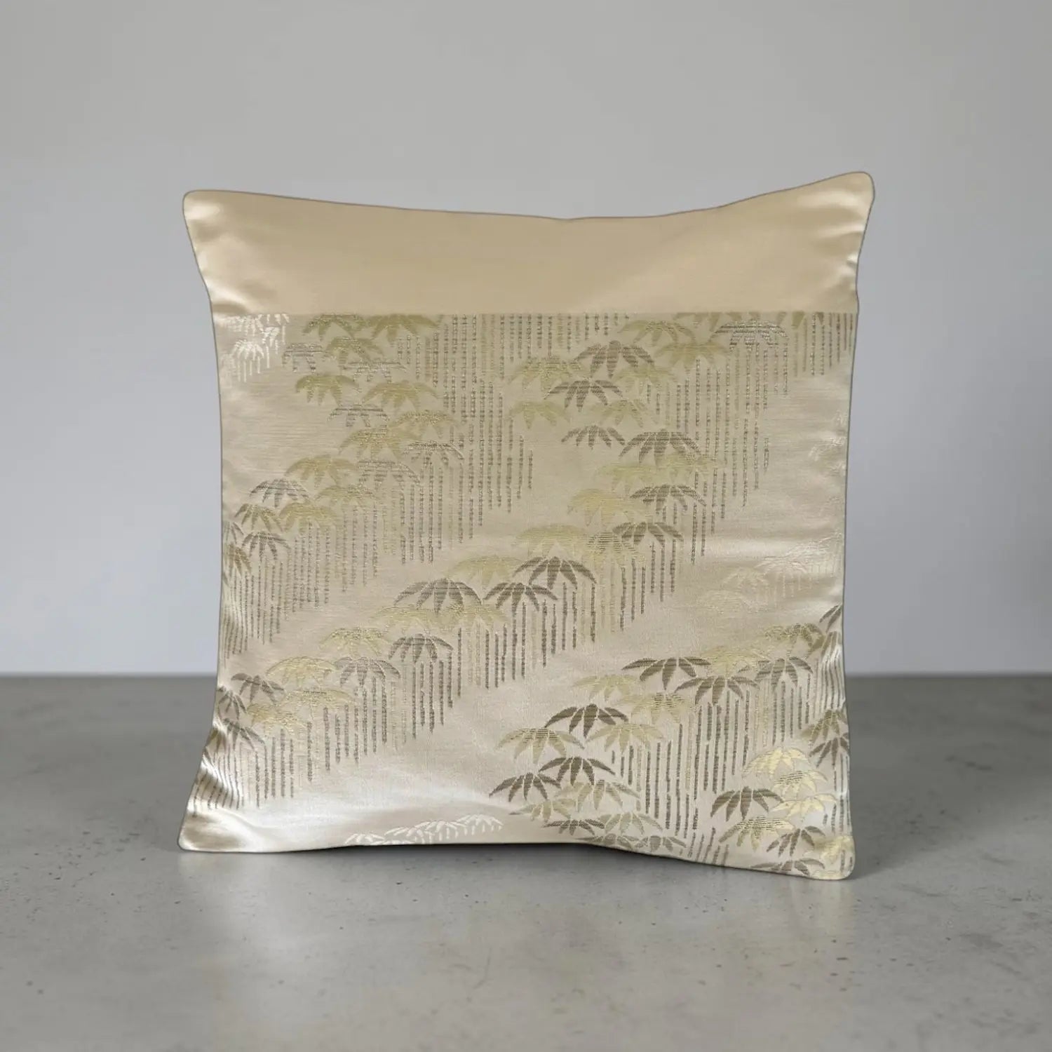 Decorative cushion with bamboo pattern on a plain background