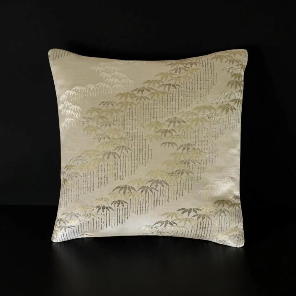 Decorative cushion with a bamboo pattern on a black background