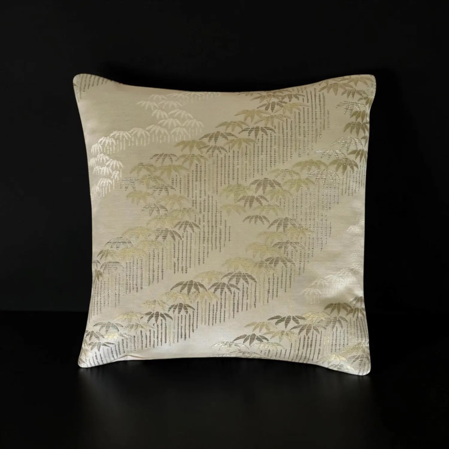 Decorative cushion with a bamboo pattern on a black background