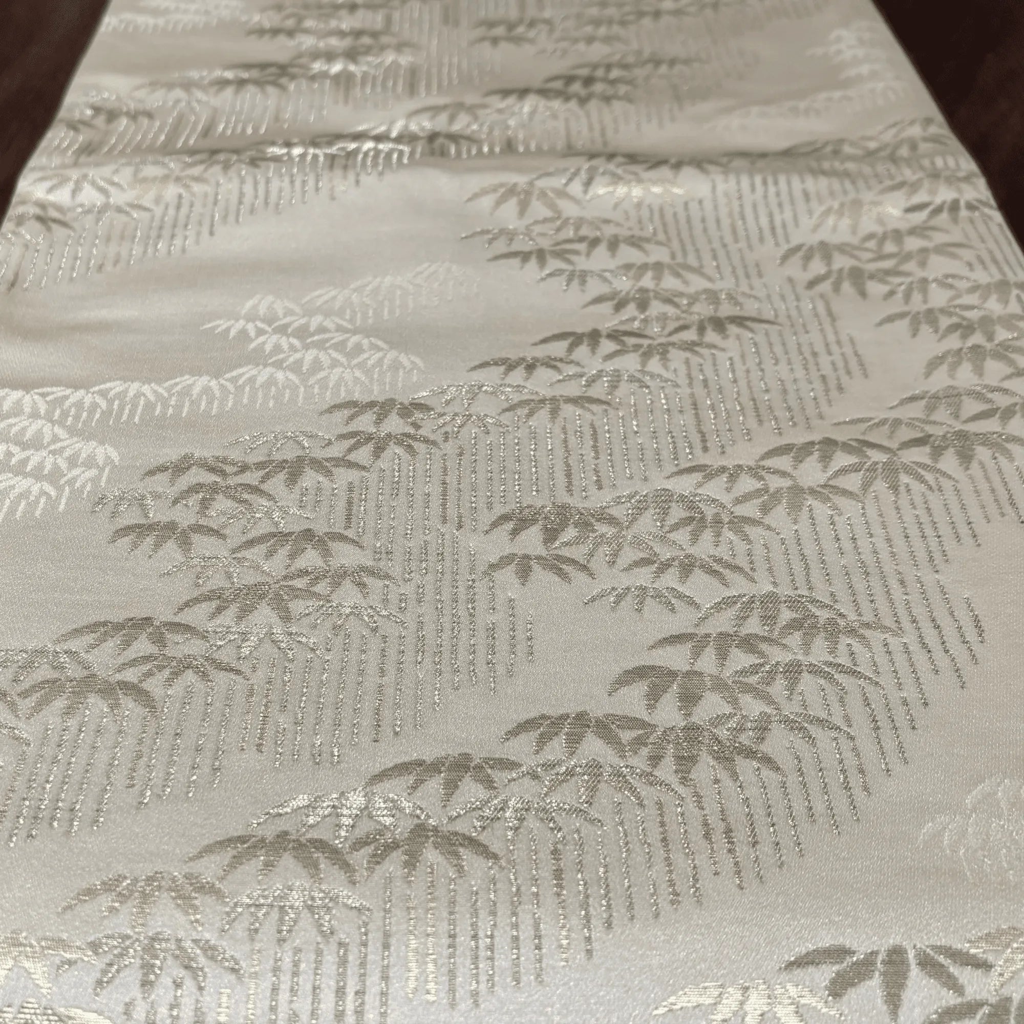 Gold metallic fabric with bamboo pattern on a gold background