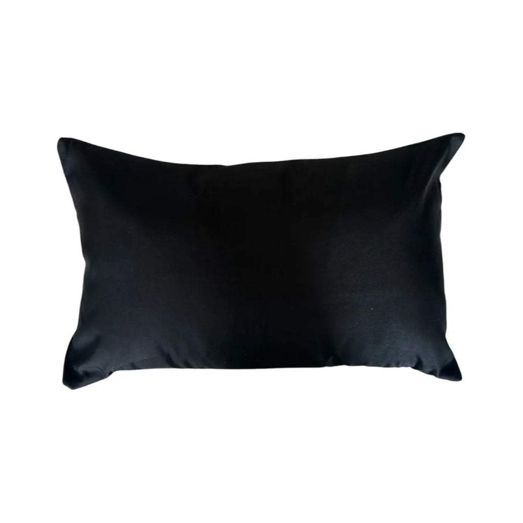 Black silk cushion on a white background