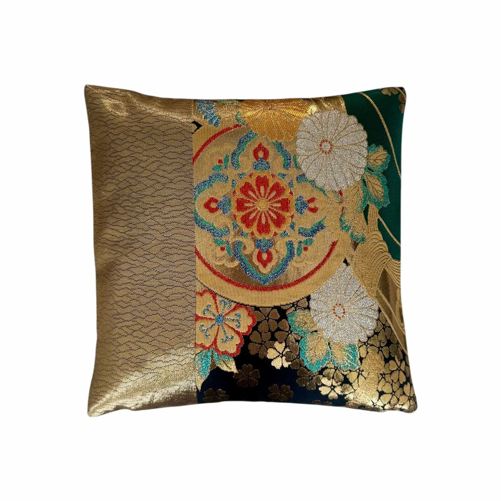 Decorative cushion with floral patterns and gold accents on a white background