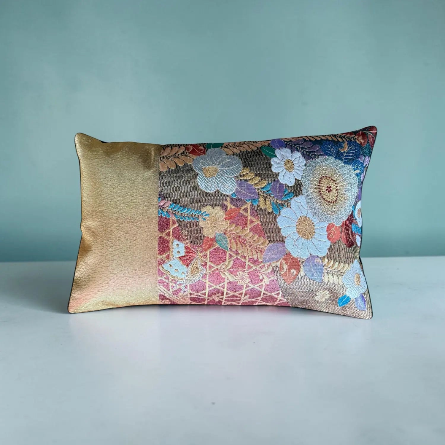 Decorative cushion with floral pattern on a plain background