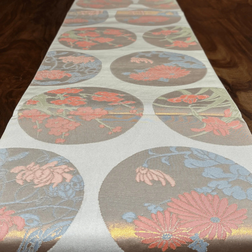 Floral patterned table runner on a wooden surface