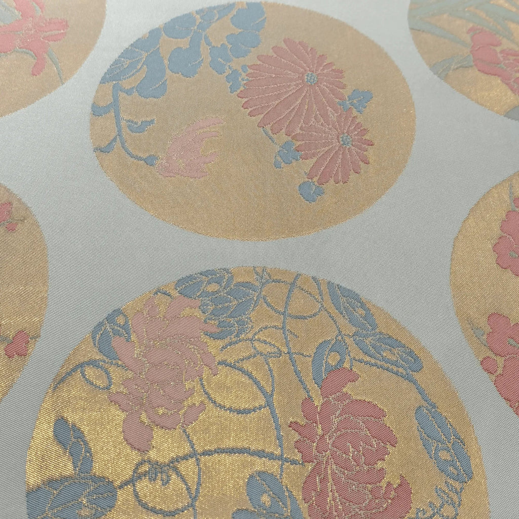 Floral patterned silk Obi with pink and blue flowers on a beige background