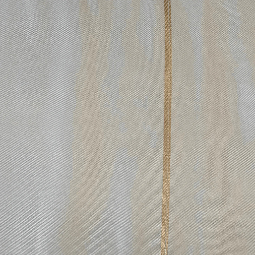 Close-up of silk fabric with a thin gold line.