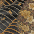 Decorative pattern with gold flowers and leaves on a black background
