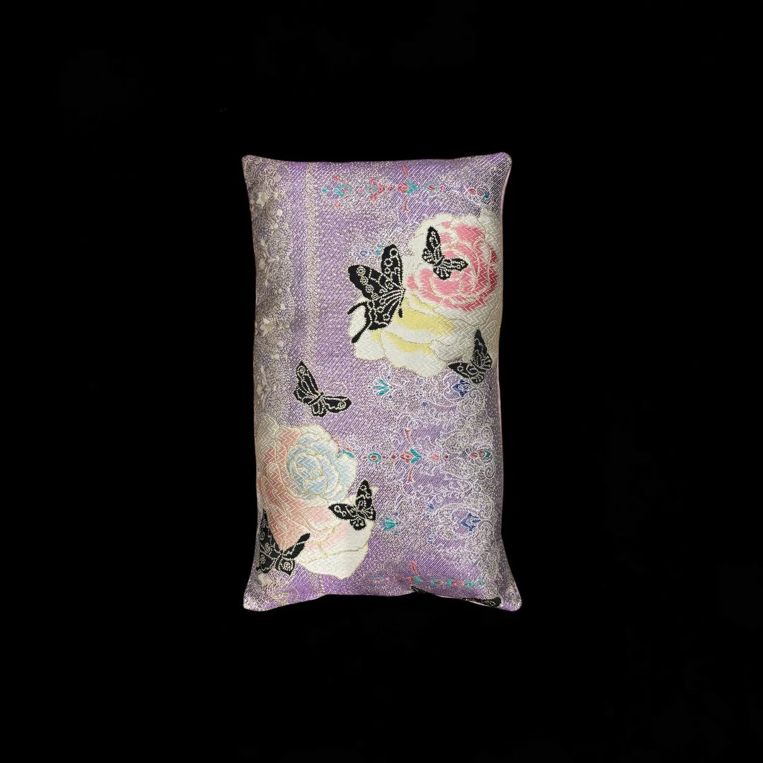 Decorative cushion with butterfly and floral pattern on a black background