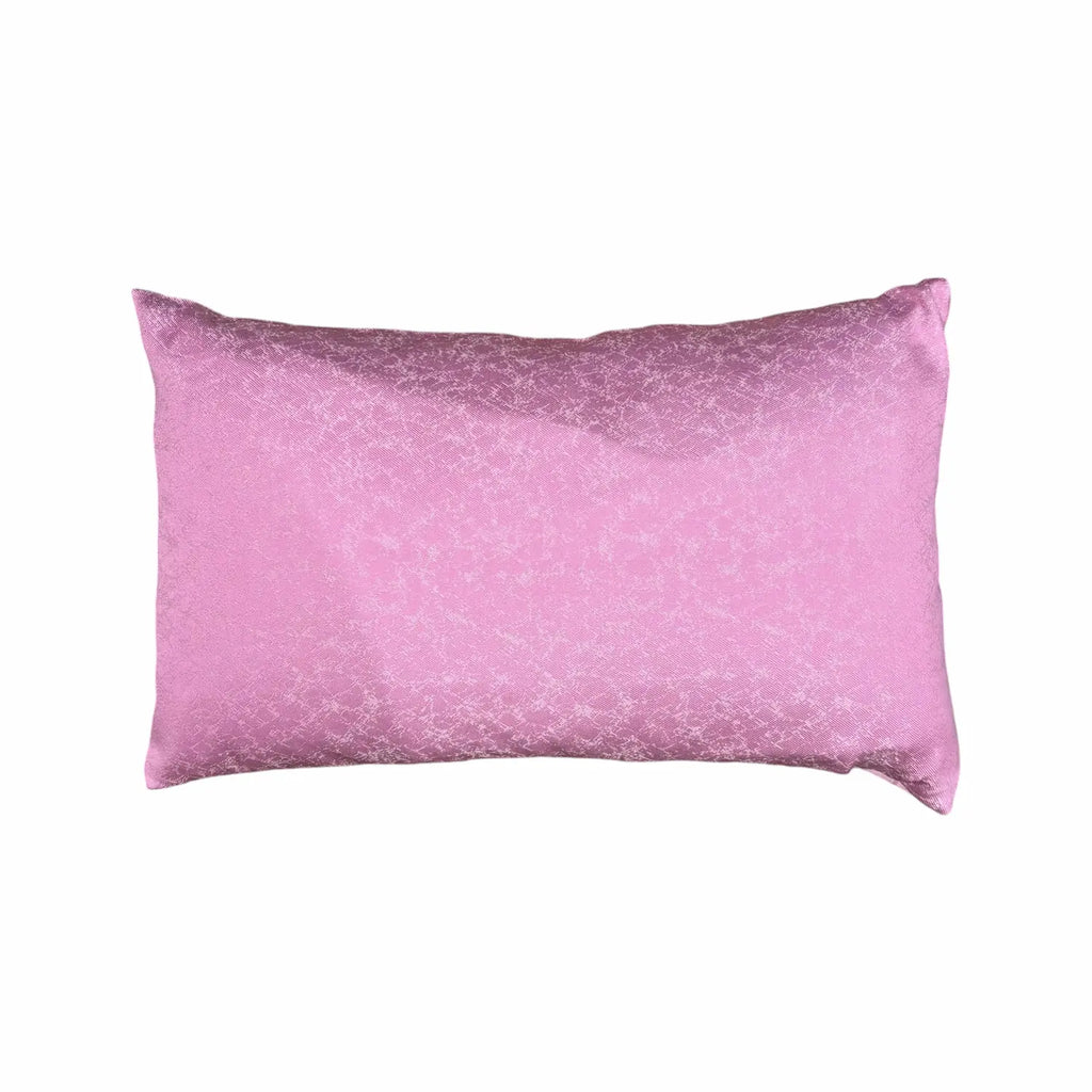 Pink cushion with a subtle pattern on a white background