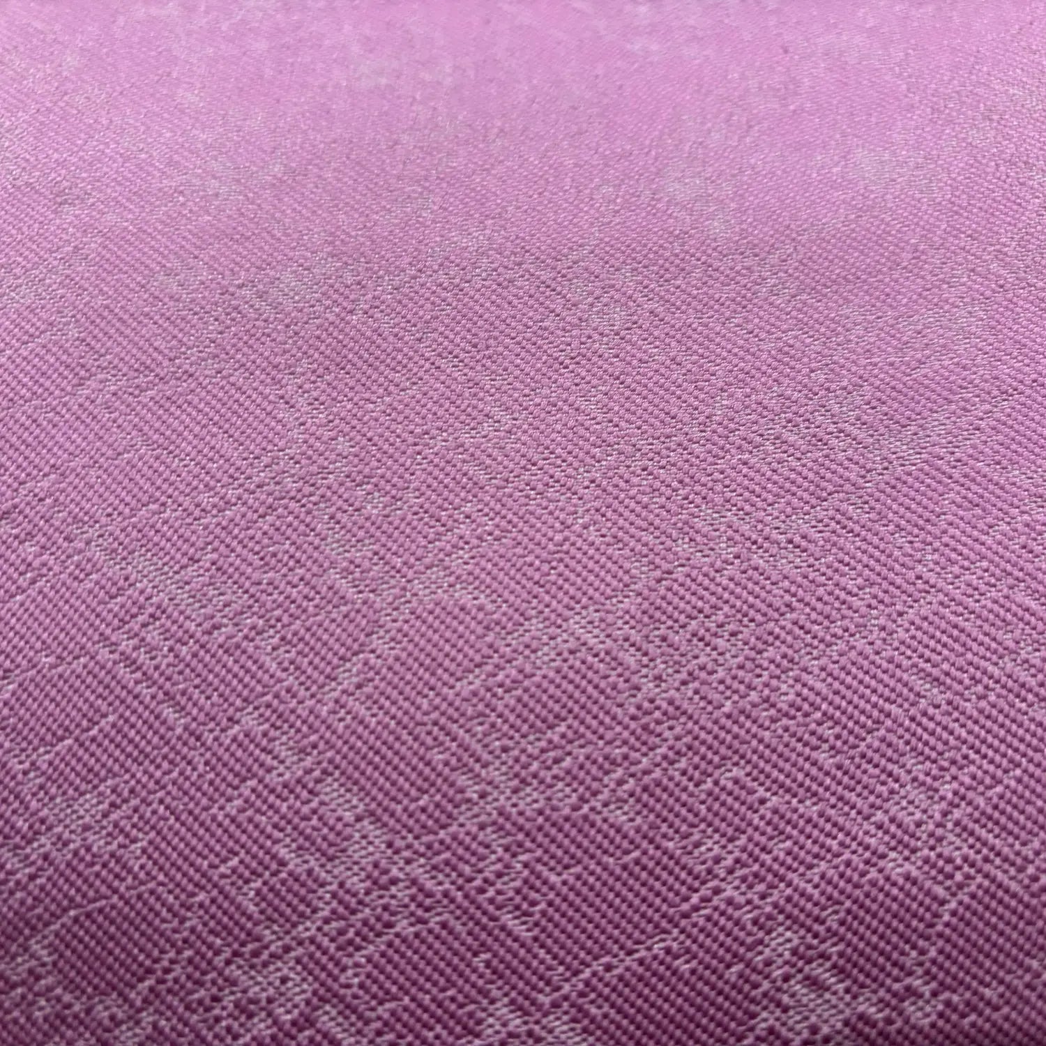 Close-up of pink fabric with a subtle pattern