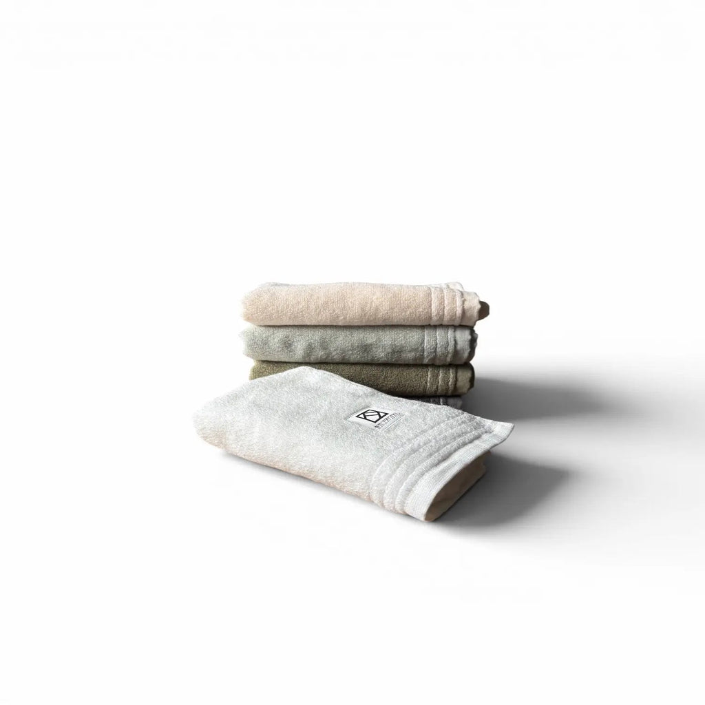Stack of folded Senshu hand towels Sawa on a white background