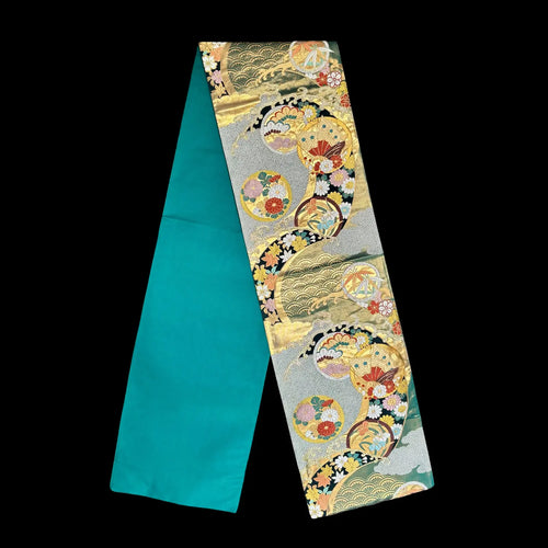 Decorative fabric with intricate patterns on a black background