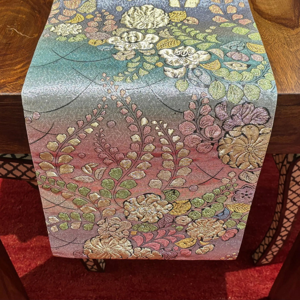 Floral patterned table runner on a wooden surface