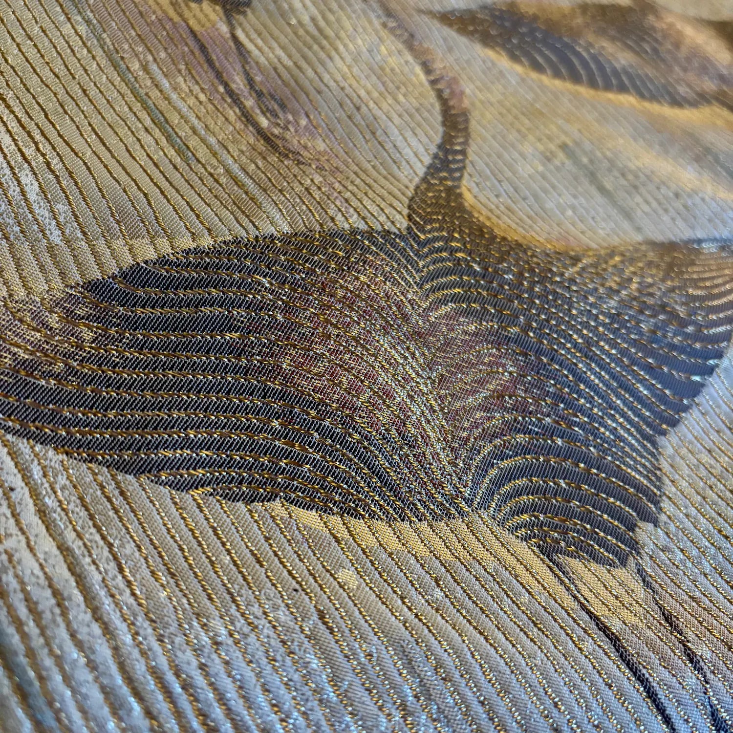 Close-up of a textured fabric with crane pattern