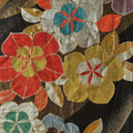 Close-up of a silk Obi with colorful floral patterns