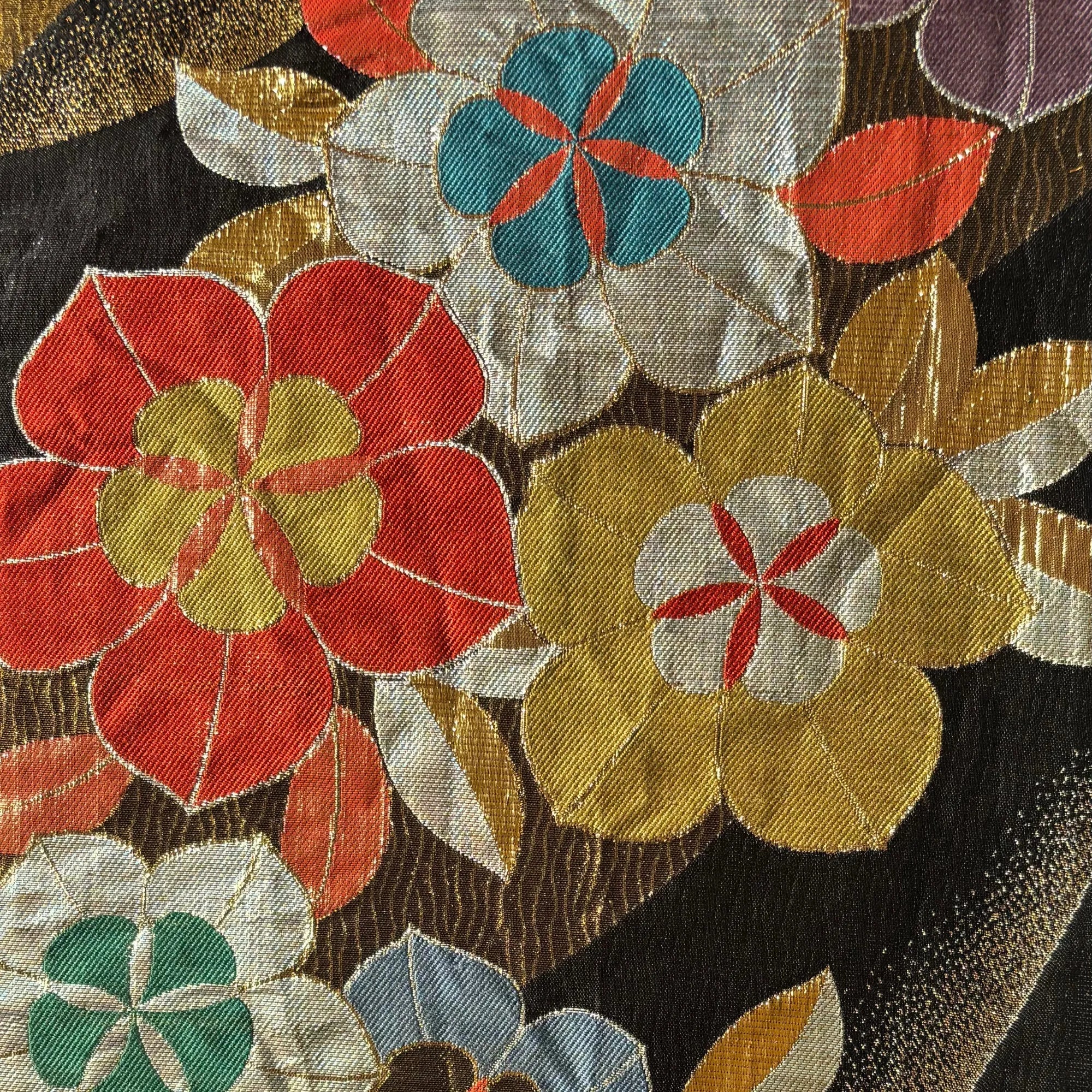 Close-up of a silk Obi with colorful floral patterns