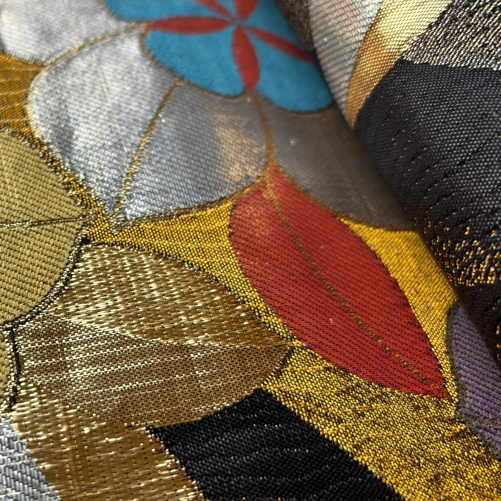 Close-up of colorful silk Obi with floral patterns