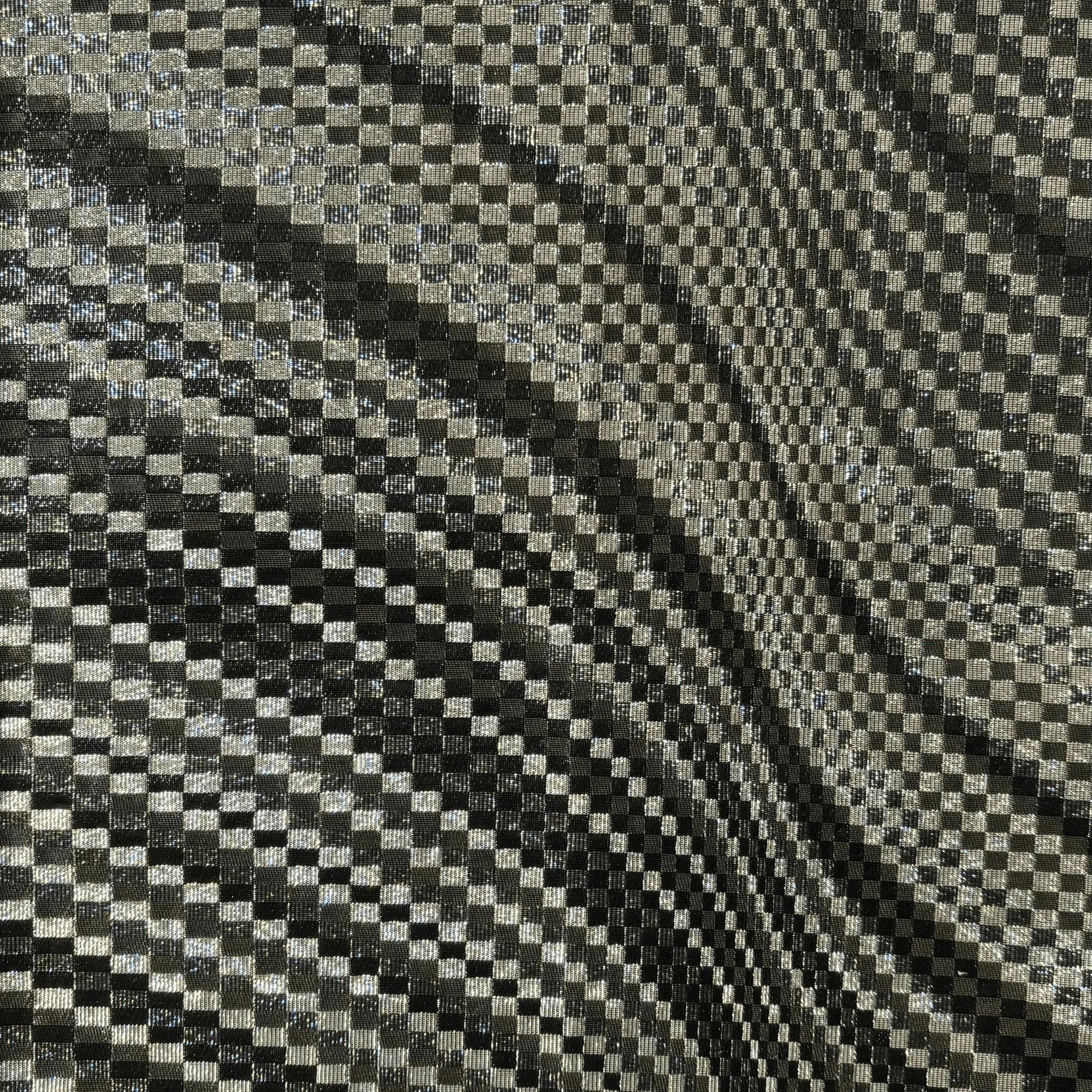 Checkered fabric pattern with black and silver squares