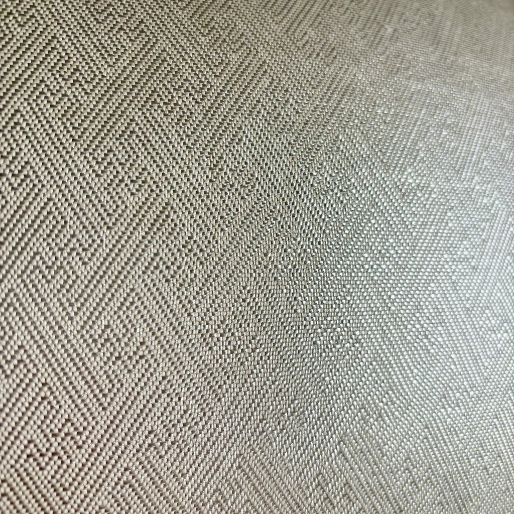 Close-up of a textured fabric with a herringbone pattern.