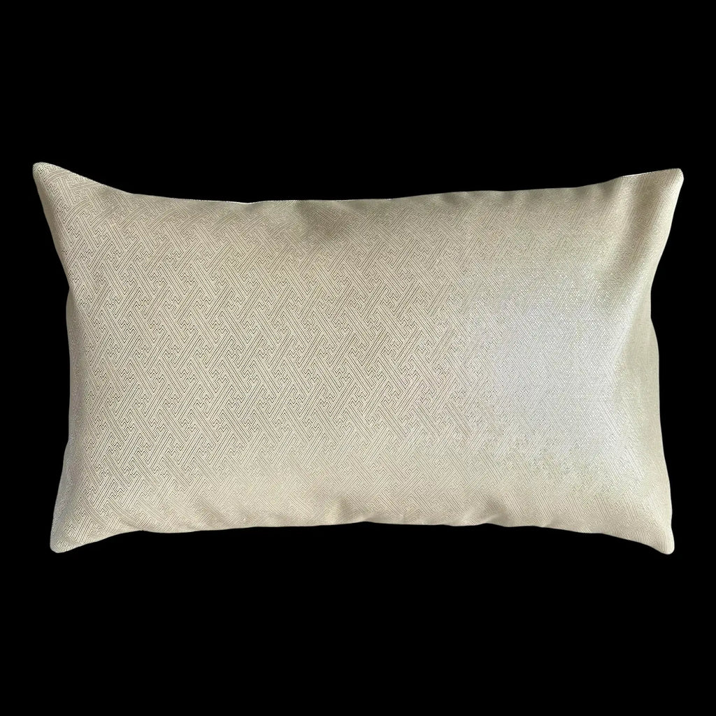 Silver textured cushion on a black background