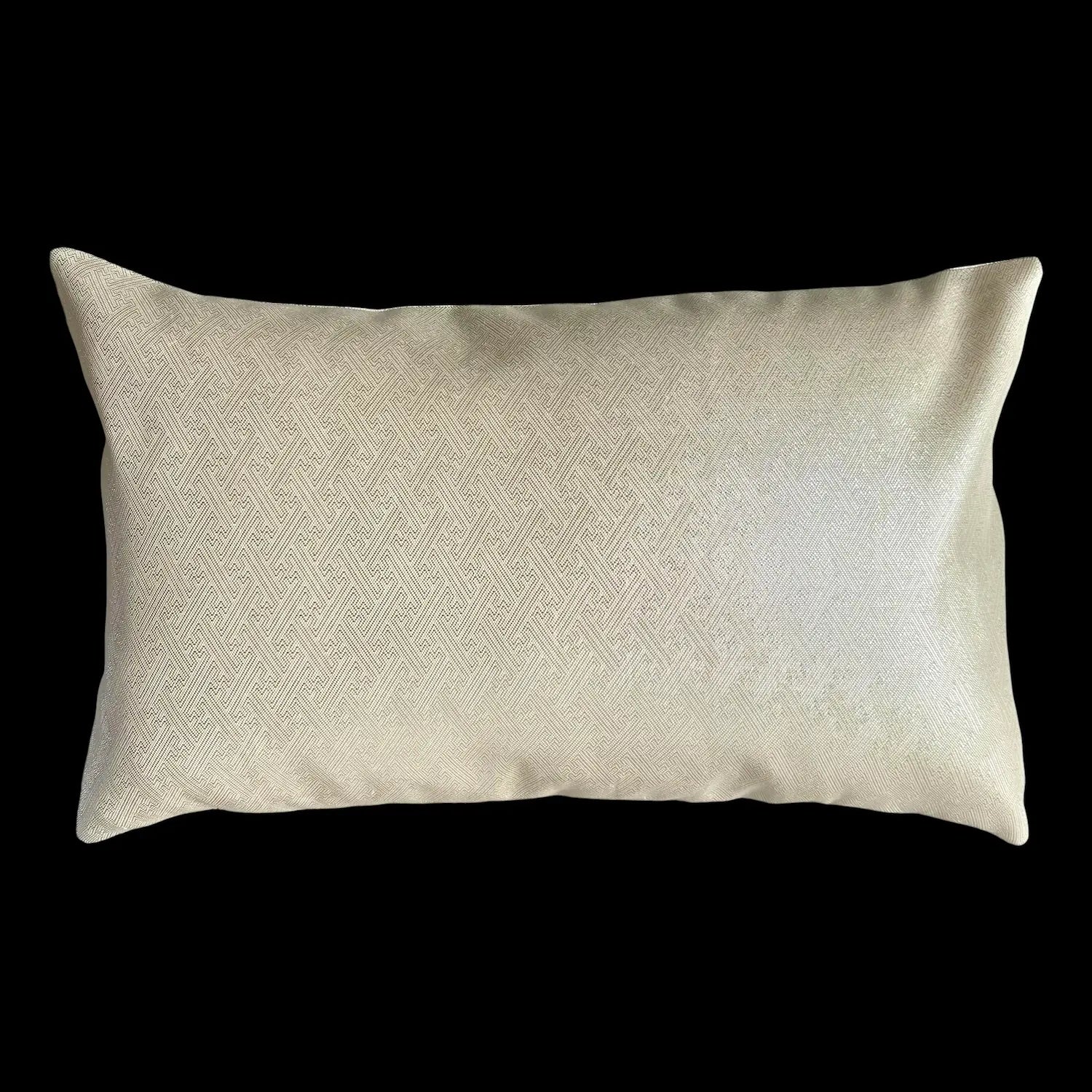 Silver textured cushion on a black background