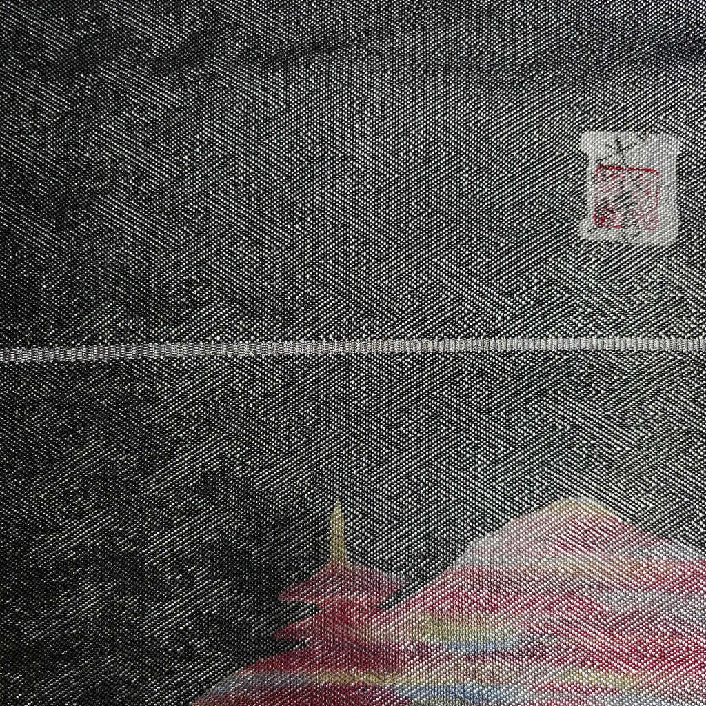 Close-up of textured fabric with a brand label in the corner