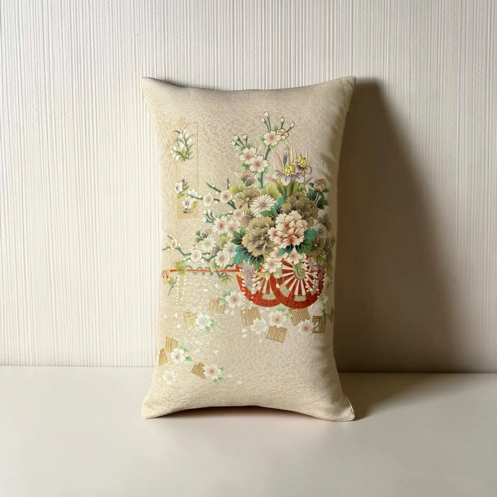 A rectangular beige cushion, set against a textured off-white background.