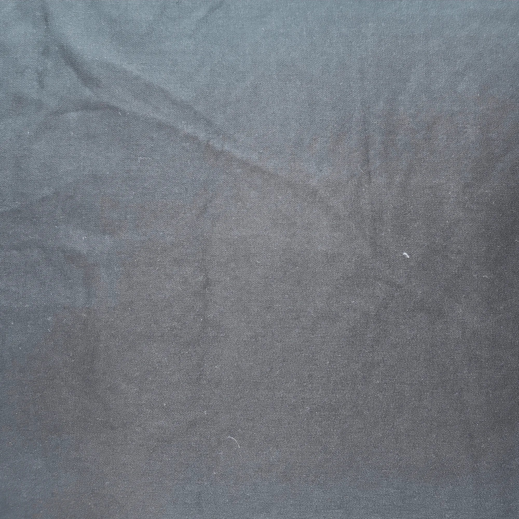 Close-up of a textured black fabric surface