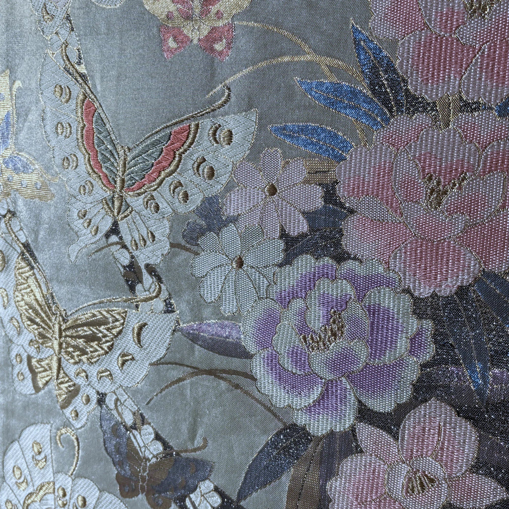 Close-up of floral and butterfly pattern on fabric