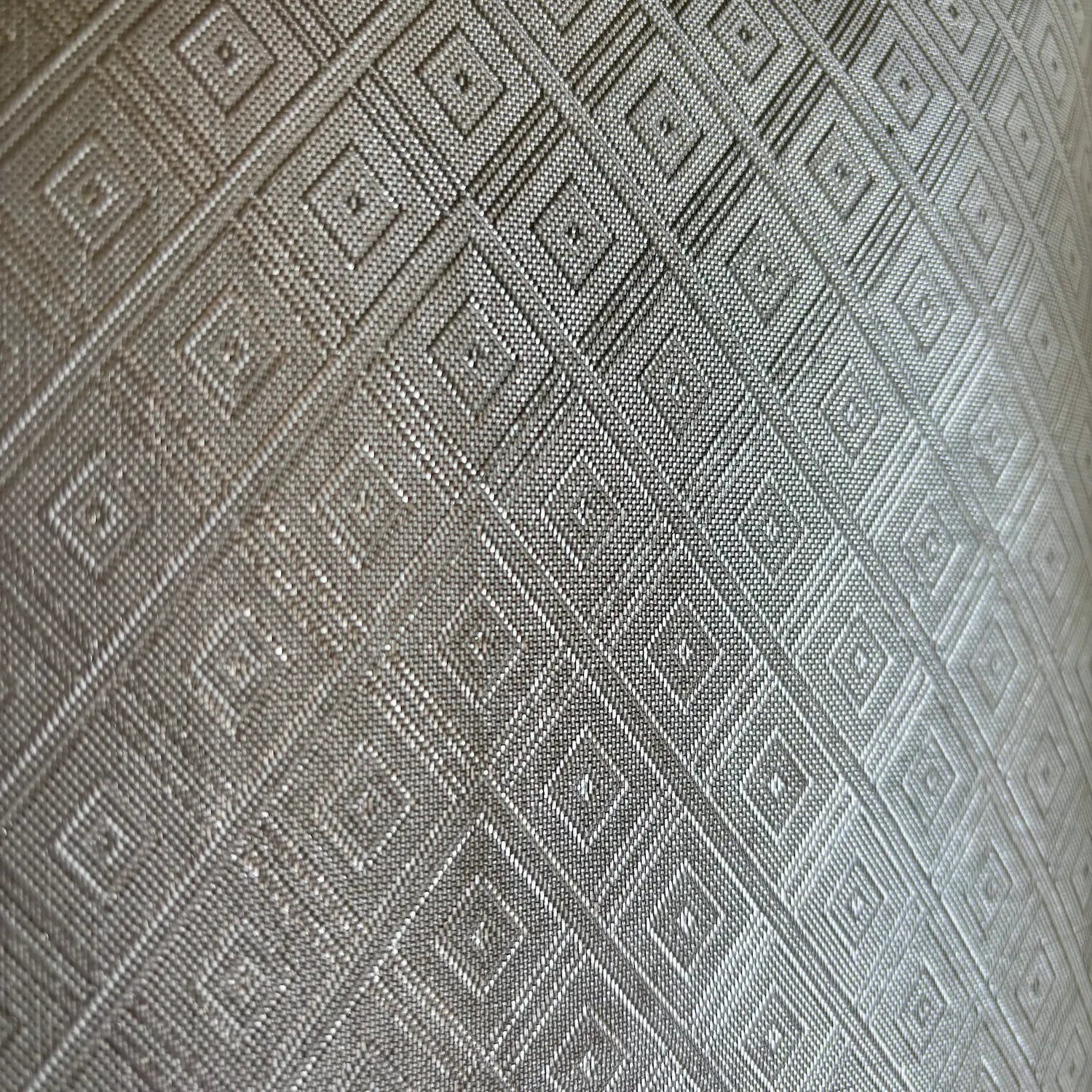 Cream textured diamond patterned fabric